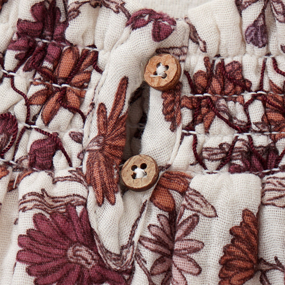 Mousseline blouse voor baby’s met smokwerk