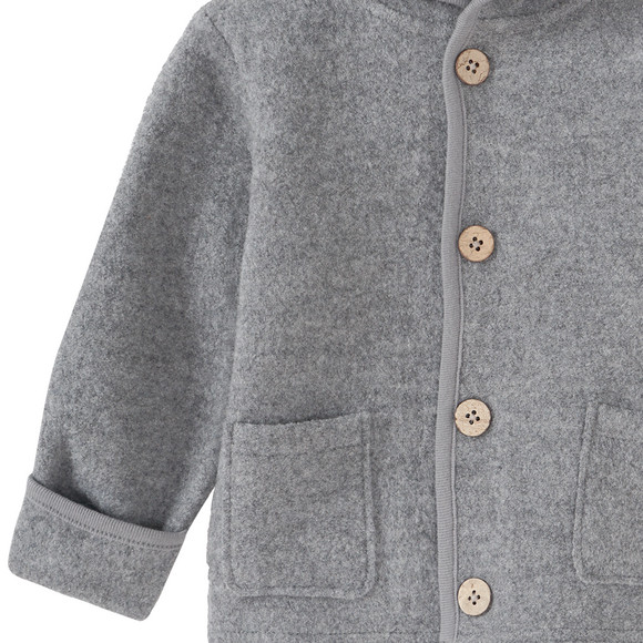 Wollen babyvest met omgeslagen boorden