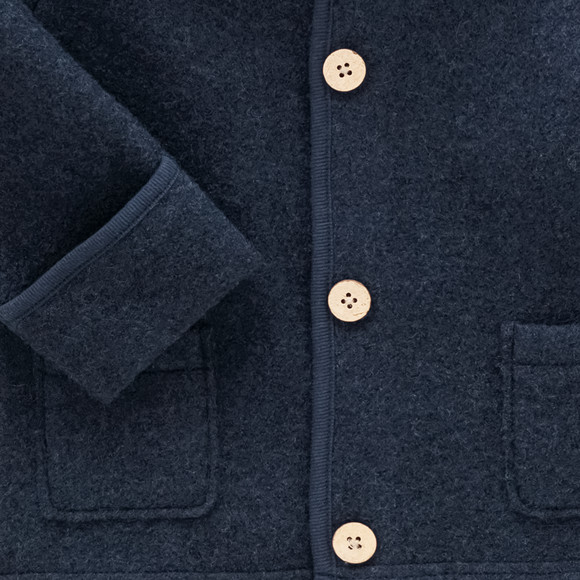 Wollen babyvest met omgeslagen boorden