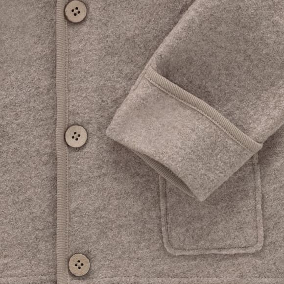 Wollen babyvest met omgeslagen boorden