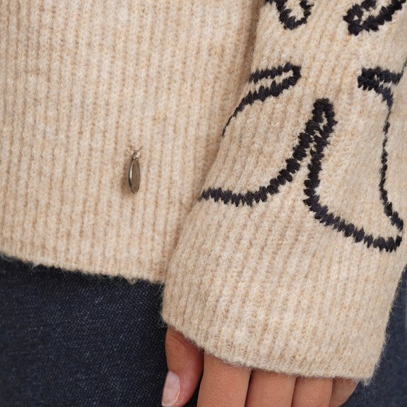 Gebreide damestrui met borduursel