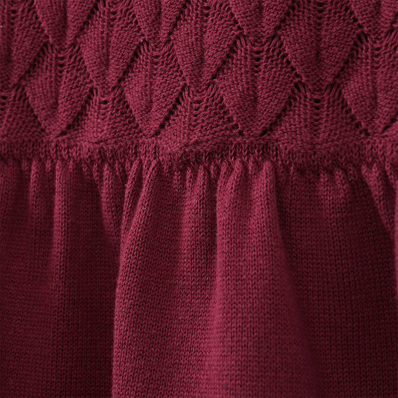 Gebreide meisjesjurk met honingraatstructuur