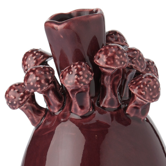 Vase mit kleinen Pilzen