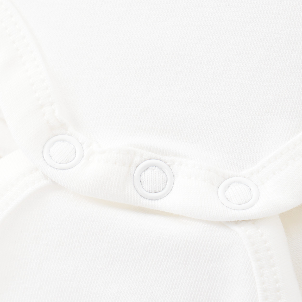 5 baby rompers in effen kleuren