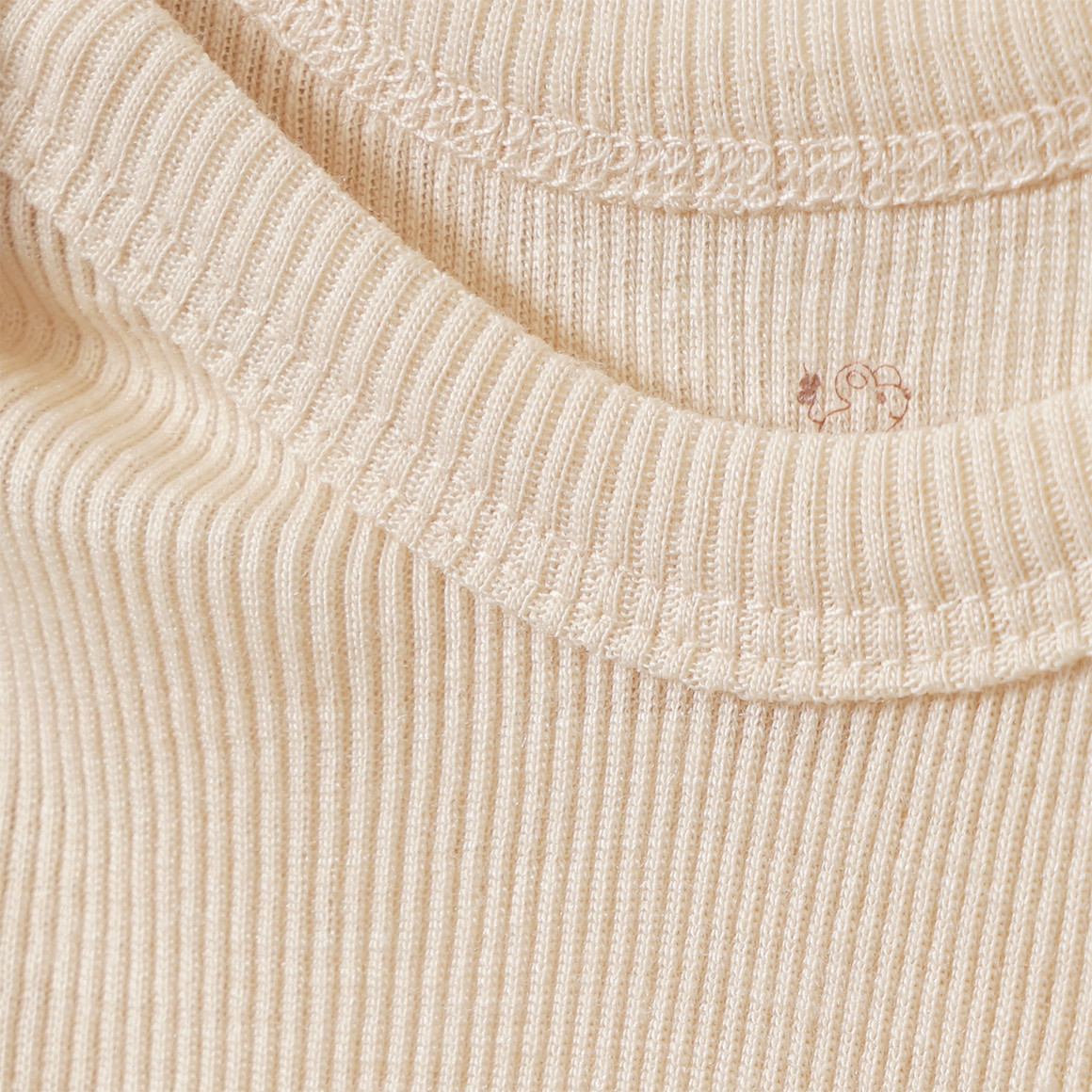 Babybody van wol en zijde met geribde textuur
