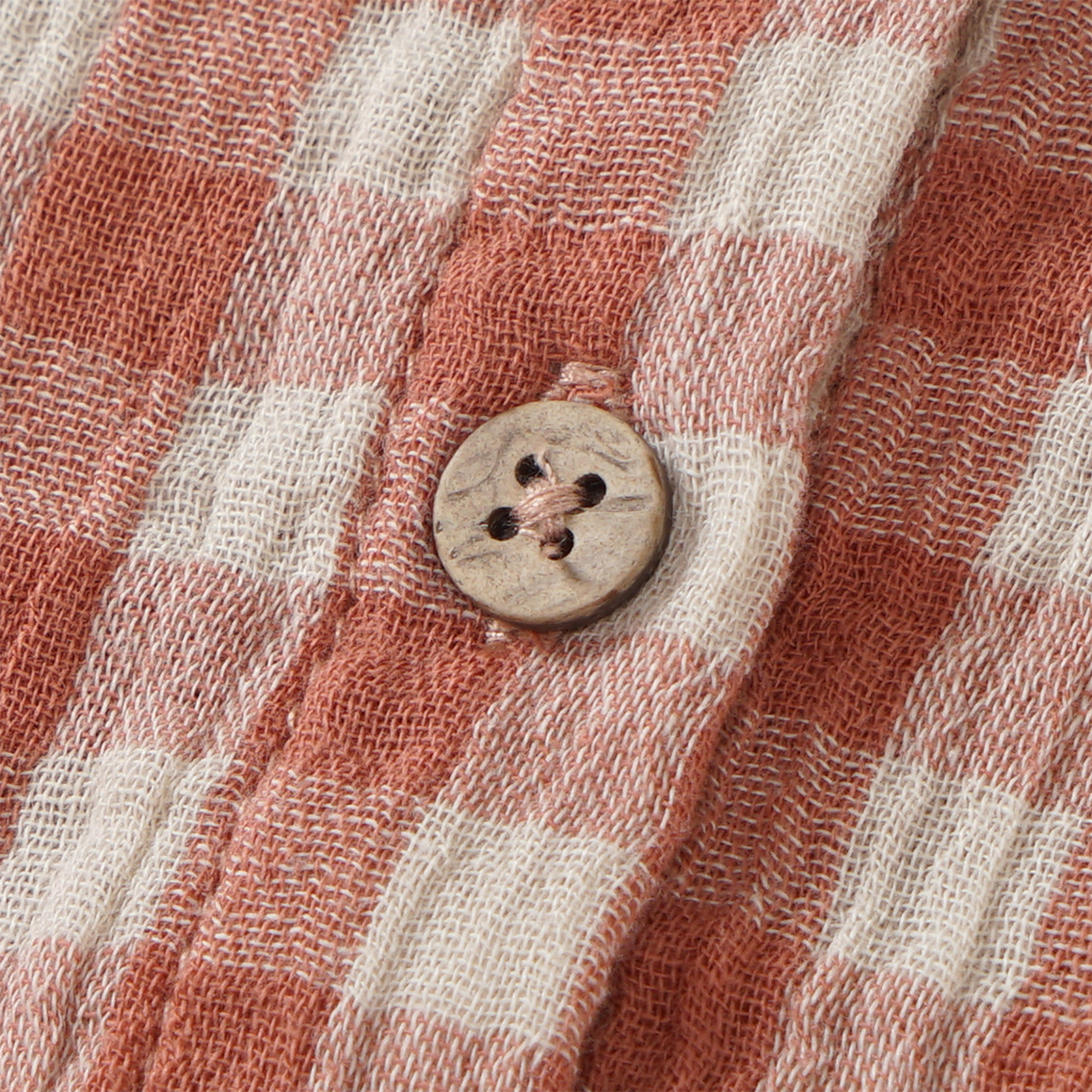 Babyjurk van mousseline met ruitenpatroon