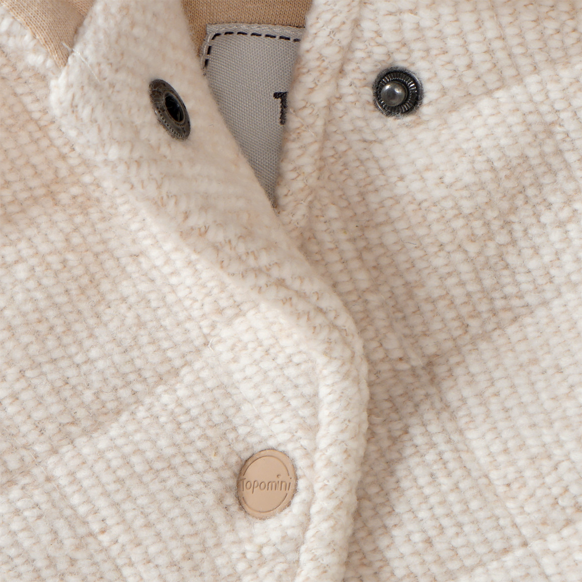 Gewatteerd babyjack in wollen look