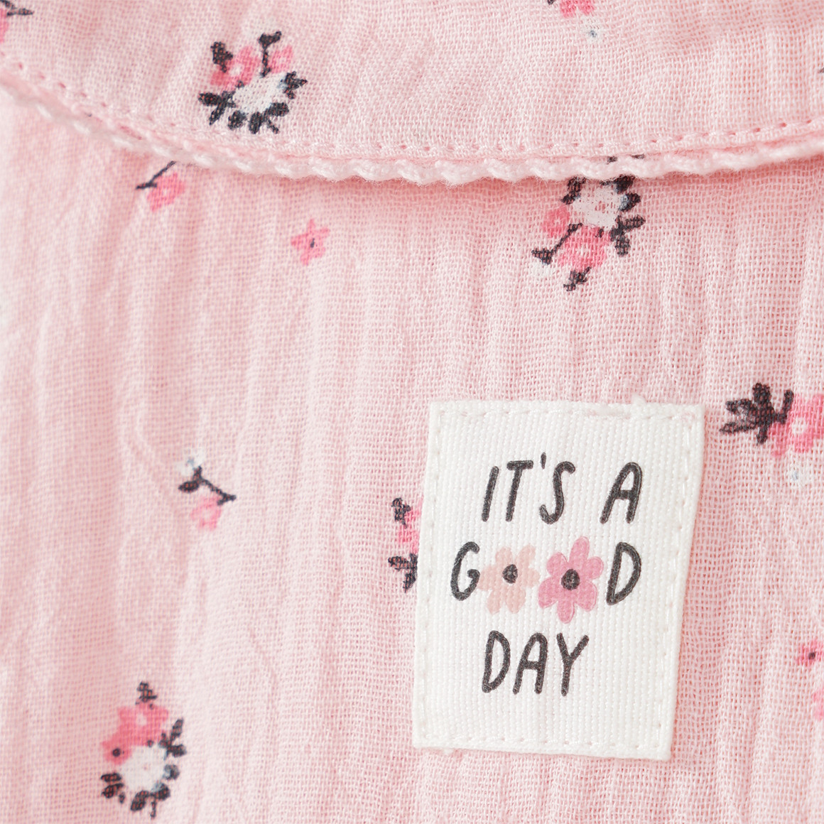 Mousseline babyblouse met bloemen allover