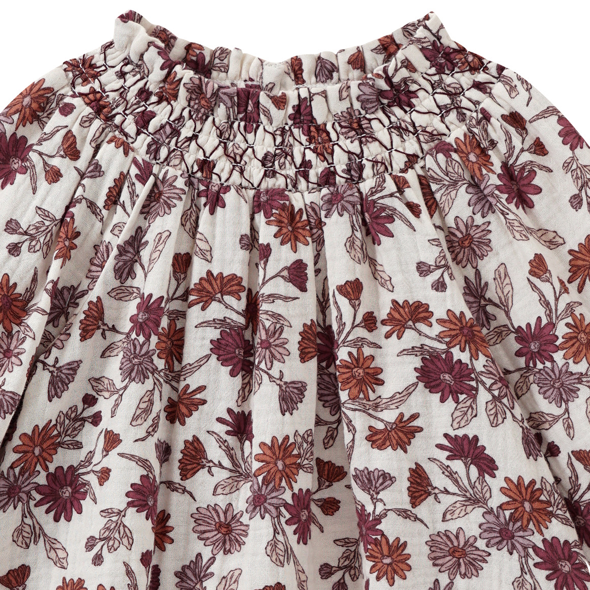 Mousseline blouse voor baby’s met smokwerk