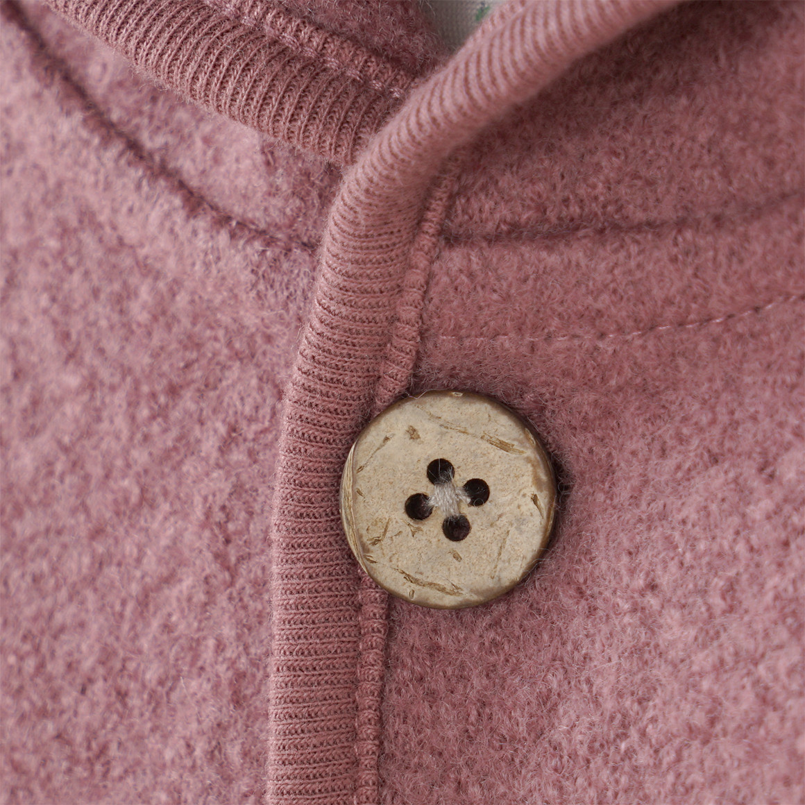 Wollen babyvest met omgeslagen boorden