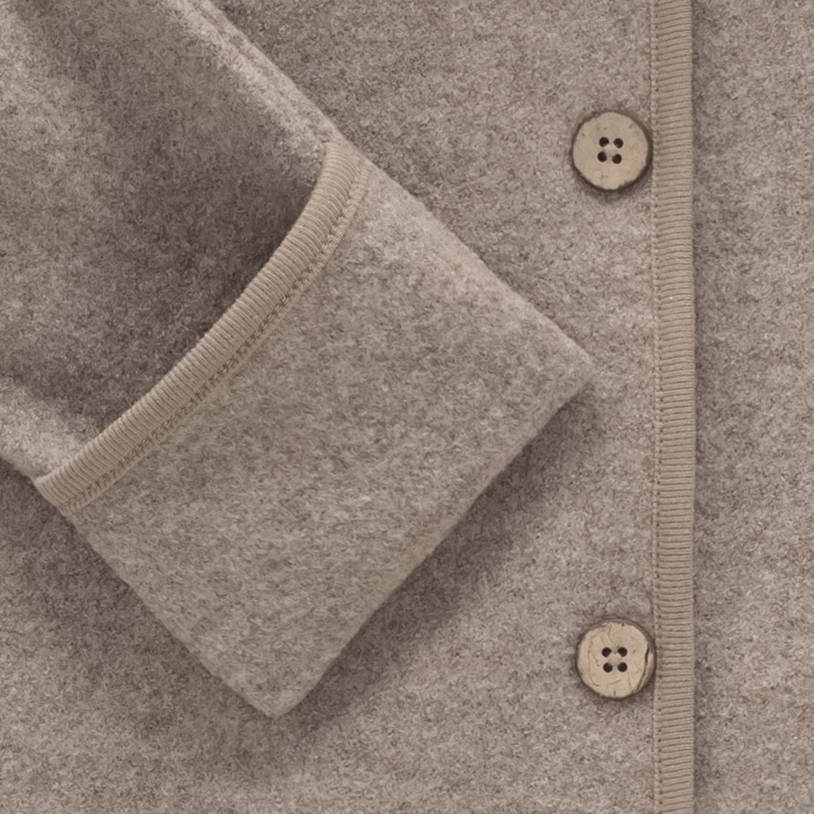 Wollen babyoverall met omgeslagen boorden