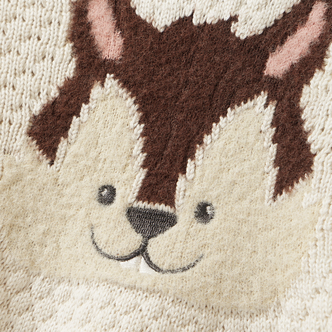 Gebreide babyjurk met dierenapplicatie