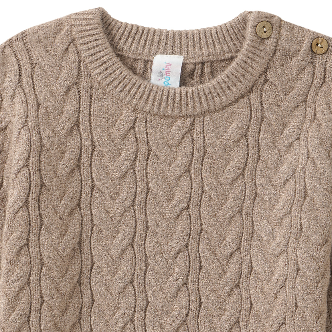 Gebreide babytrui met vlechtpatroon