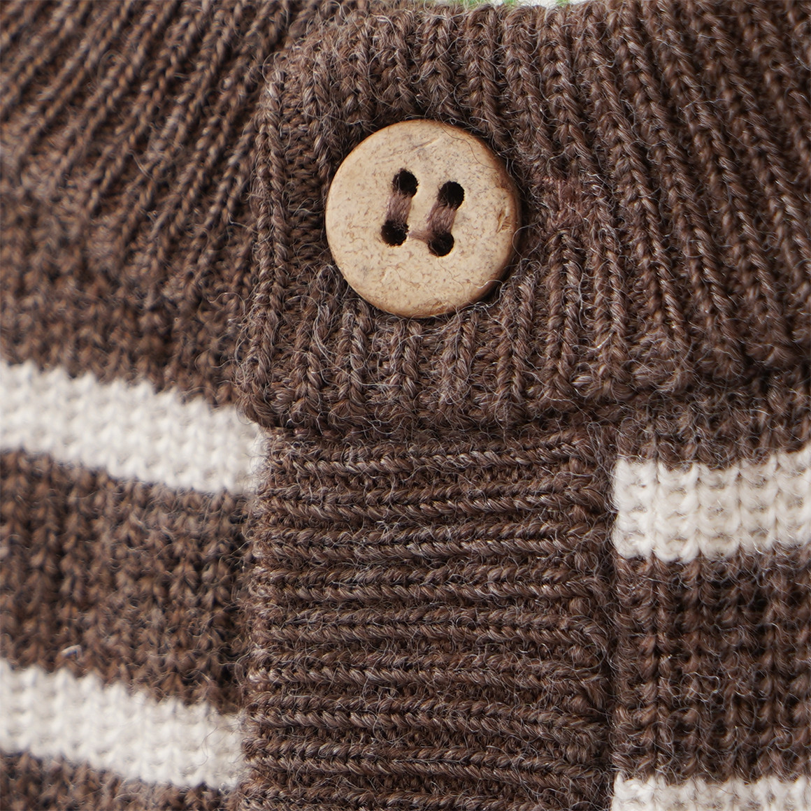 Newborn Merino-Strickjacke mit Streifen