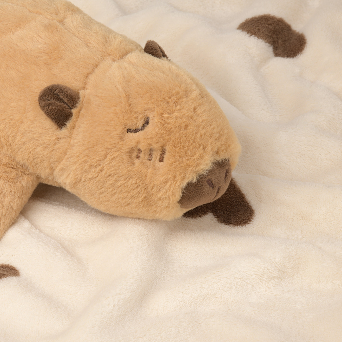 Plüschcapybara  mit Decke