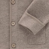 Wollen babyvest met omgeslagen boorden
