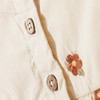 Babyjurk met bloemenstiksels