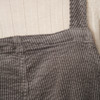 Damesovergooier met bretels van corduroy