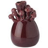 Vase mit kleinen Pilzen